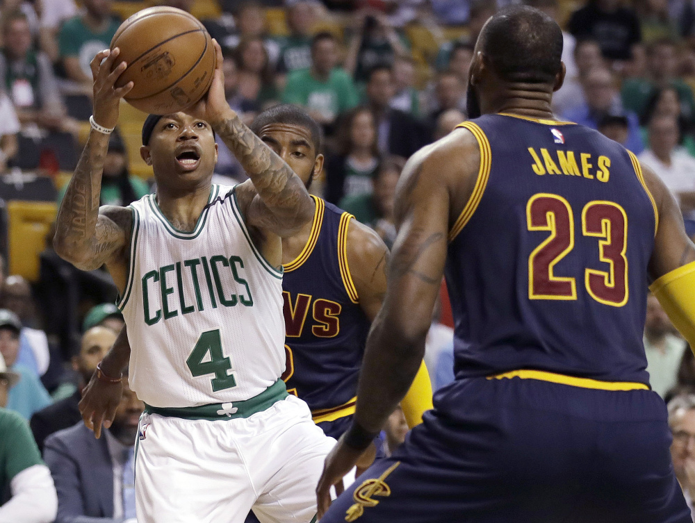 Boston Celtics guard Isaiah Thomas, left, prepares to shoot as Cleveland Cavaliers forward LeBron James during Game 1 of the Eastern Conference finals. In Game 2 Thomas re-injured his hip and will not play the rest of the season. (Associated Press/Charles Krupa)