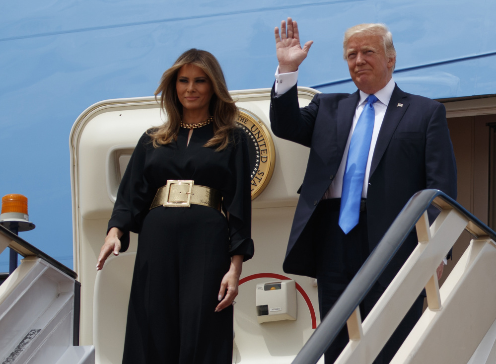 President Trump and first lady Melania arrive for a welcome ceremony at the Royal Terminal of King Khalid International Airport, Saturday. Melania Trump and the president's daughter Ivanka shunned head scarves, though they did dress conservatively, at least by Western standards.