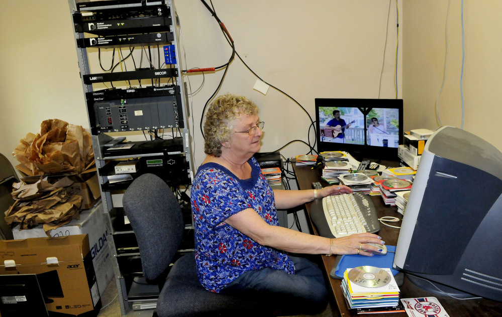 Central Maine Community Access television station manager Laura Guite works in the broadcast room in Fairfield.
