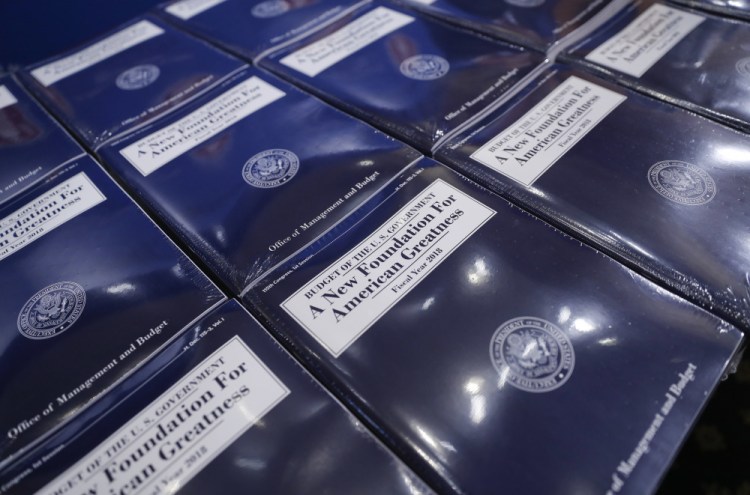 Copies of President Trump's fiscal 2018 federal budget are laid out for distribution on Capitol Hill on Tuesday.