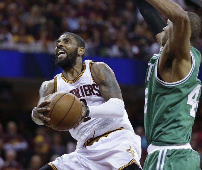 The Cleveland Cavaliers' Kyrie Irving, 2, goes up for a shot against the Boston Celtics' Al Horford, 42, duing the second half of Game 4 of the Eastern Conference finals Tuesday in Cleveland.