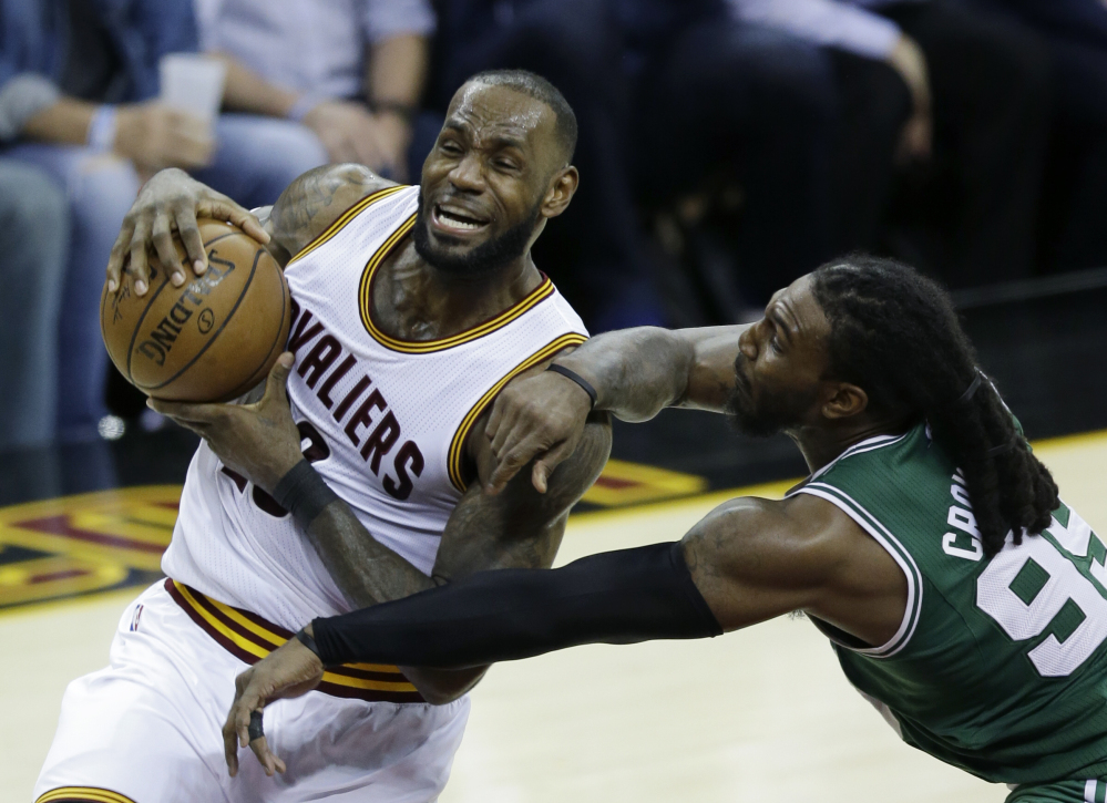 Cleveland Cavaliers forward LeBron James (23) goes up for a shot against Boston defender Jae Crowder during the second half of Game 4 of the Eastern Conference finals Tuesday.