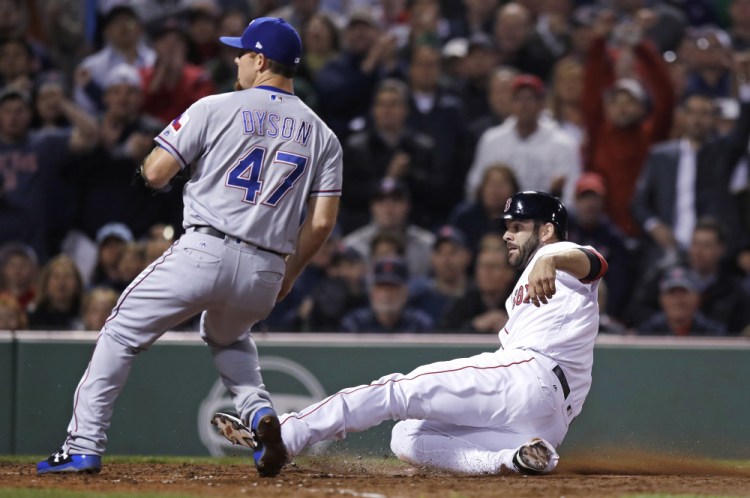 Boston's Mitch Moreland scores on a wild pitch by Rangers relief pitcher Sam Dyson in the seventh inning Wednesday night at Fenway Park.