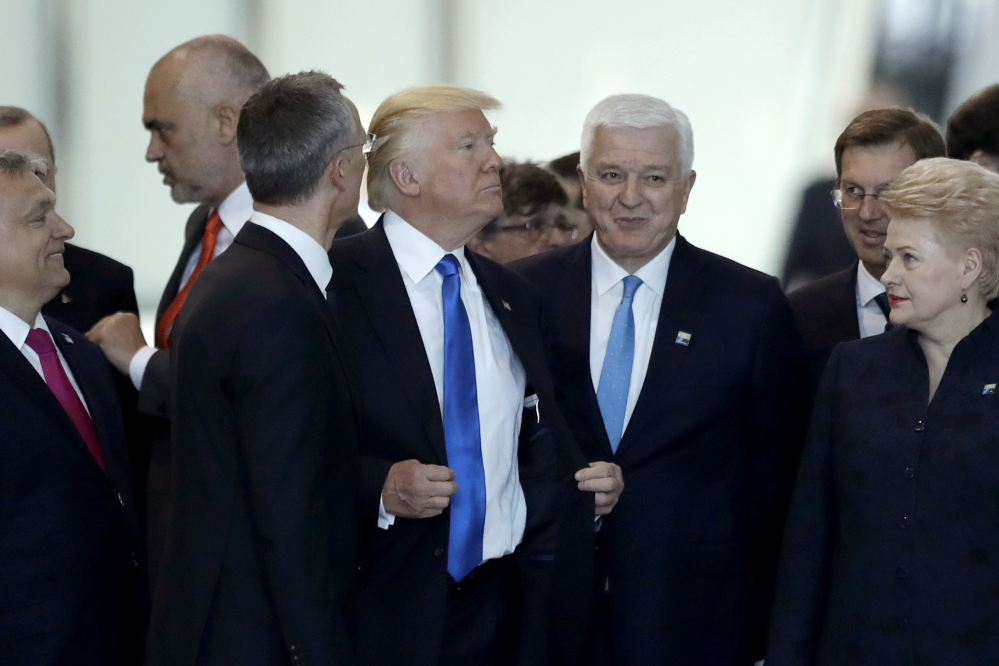 Montenegro Prime Minister Dusko Markovic, center right, appeared to be pushed aside by President Trump during a NATO summit of heads of state and government in Brussels on Thursday.