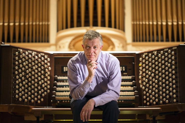 Municipal organist Ray Cornils at the Kotzschmar Organ at Merrill Auditorium. Cornils plans to retire at the end of this year.