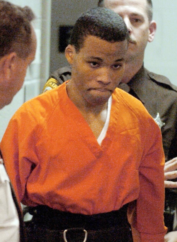 Lee Boyd Malvo, a notorious sniper, enters a court 2004.