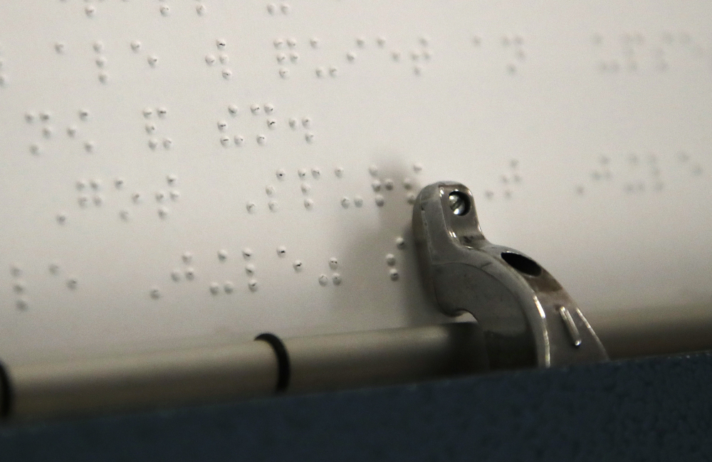An inmate types on a Perkins Brailler at the New Hampshire Correctional Facility for Women in Goffstown, N.H. Invented by Frenchman Louis Braille in the 1800s, Braille uses raised dot patterns to form letters that can be read by touch with the fingertips.