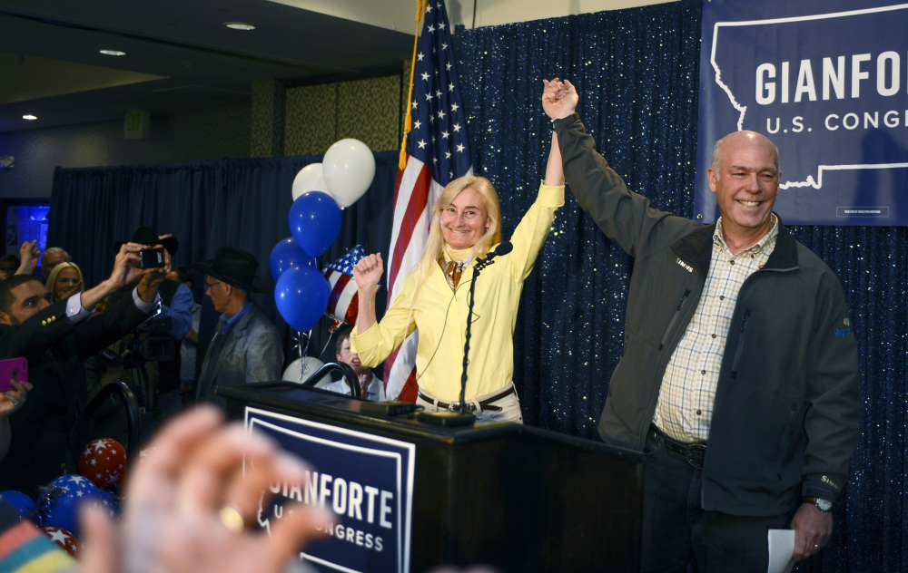 Greg Gianforte, right, and wife Susan, celebrate his win over Rob Quist for the open congressional seat at the Hilton Garden Inn Thursday night in Bozeman, Mont. Gianforte could face jail time and a fine if convicted of an assault charge.