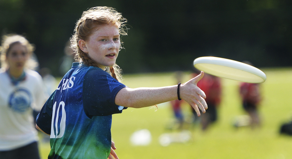 Sarah Knupp of Cape Elizabeth passes the disc during the Ultimate high school state finals Saturday at New Gloucester Fairgrounds. Cape became just the second team to win a state title after Fryeburg Academy won the first three. Cape beat Falmouth in the final, 13-4.