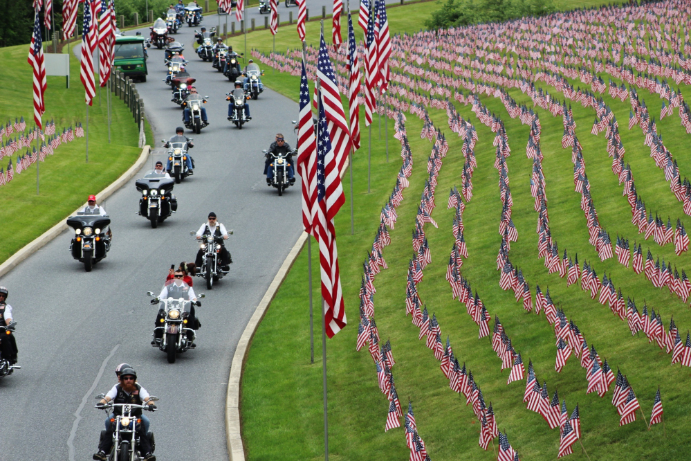 Motorcyclists ride into Indiantown Gap National Cemetery in Annville, Pa., for a Memorial Day weekend program. 