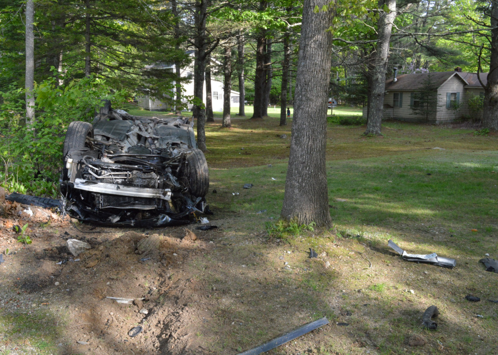 An Audi rests on its roof after its driver lost control in Standish on Sunday.