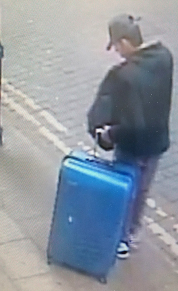 Suicide bomber Salman Abedi pulls a distinctive blue suitcase in a picture taken in the days before the blast at an Ariana Grande concert in Manchester, England.