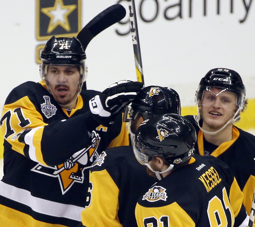 Pittsburgh's Evgeni Malkin leads the NHL in playoff scoring and doesn't mind playing second fiddle to Sidney Crosby as long as the team wins championships.