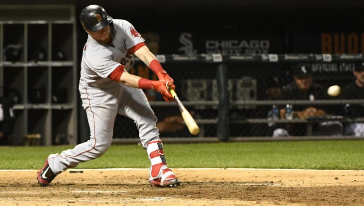 Boston's Christian Vazquez hits an RBI double against the Chicago White Sox in the sixth inning Wednesday night in Chicago.