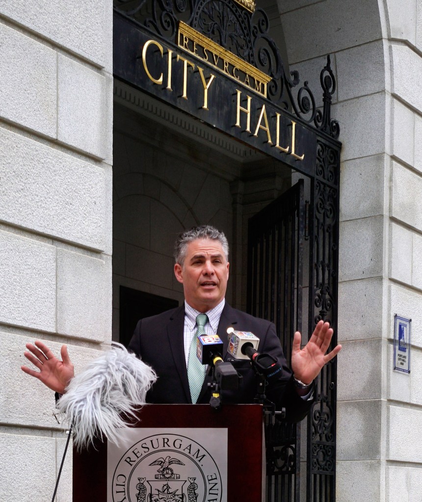 Mayor Ethan Strimling holds a news conference outside Portland City Hall on Monday to announce the creation of a task force to study the city's charter. 