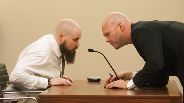 Leroy Smith III, left, confers with defense attorney Scott Hess during a hearing on Smith's mental competence to tried for murder, in connection with the slaying and dismembering of his father in May 2014, on Friday Jan. 20, 2017 at Capital Judicial Center in Augusta.
