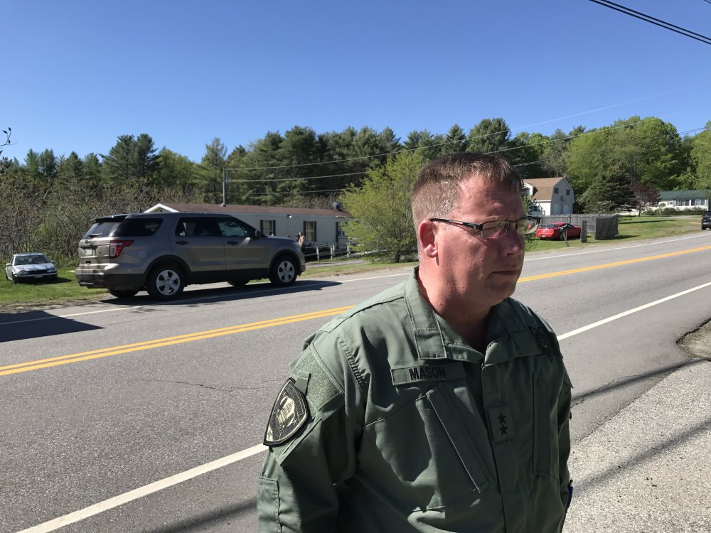 Ken Mason, Kennebec County sheriff, speaks Saturday morning outside the Belgrade mobile home where one man was killed and one person was injured in an officer-involved shooting the previous night.