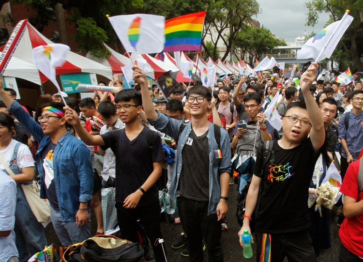Supporters cheer after the Constitutional Court ruled in favor of same-sex marriage outside the Legislative Yuan in Taipei, Taiwan, on Wednesday.