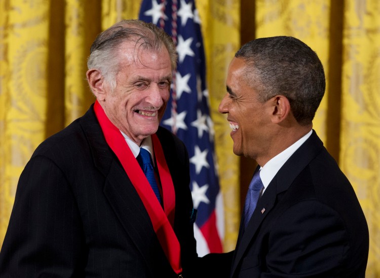 Frank Deford is awarded the National Humanities Medal by President Obama during a ceremony at the White House in 2013.