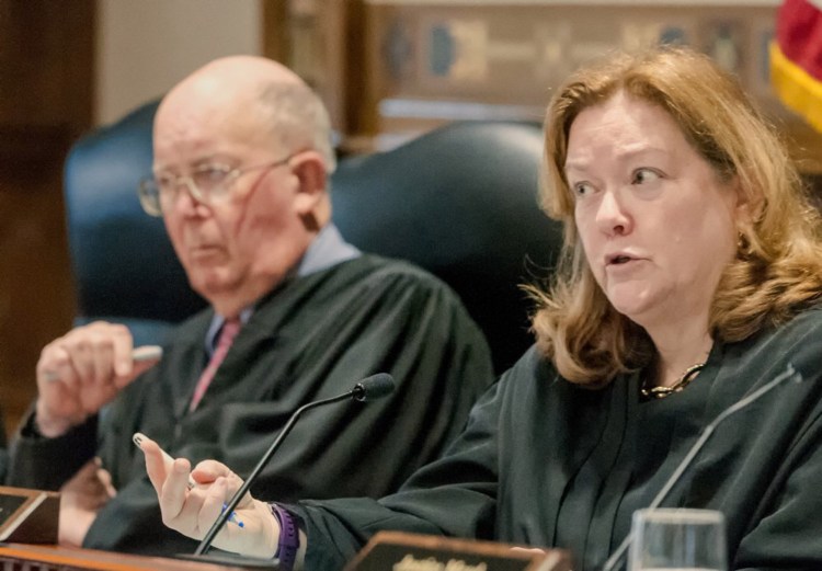 Chief Justice Leigh Saufley of the Maine Supreme Judicial Court and Donald G. Alexander, senior associate justice, seen last year. Saufley said during Wednesday's arguments on voter-approved Medicaid expansion, "A lot of this is a political question."