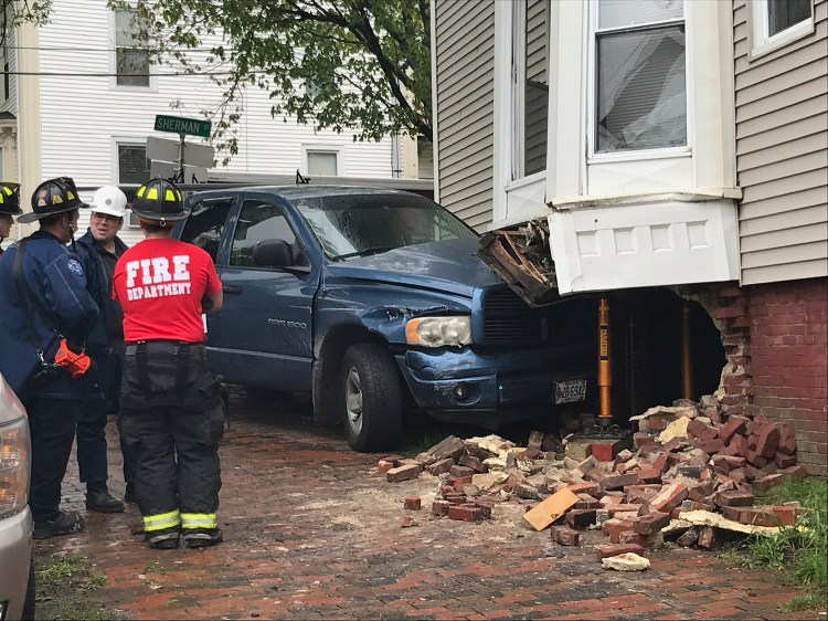 A pickup truck crashed into a building at High and Sherman streets in Portland on Friday afternoon.