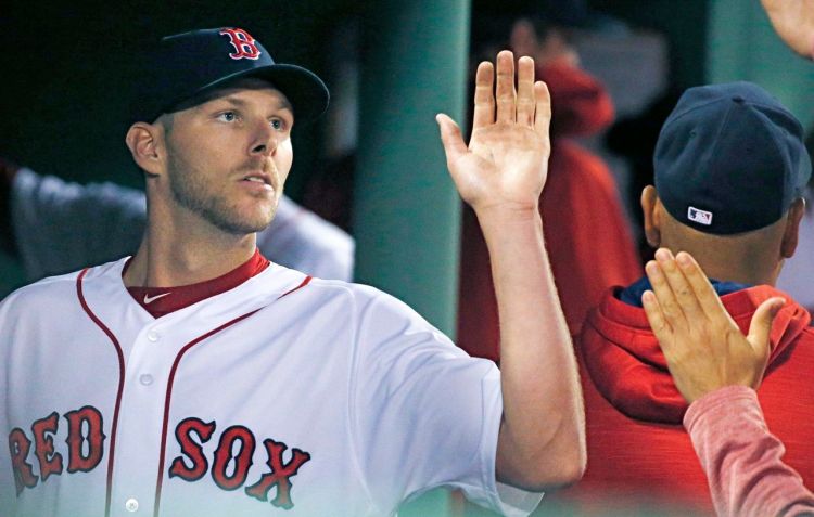 Chris Sale, who pitched through eight innings and notched a 5-2 win over the Orioles, is greeted in the dugout with high-fives Tuesday.