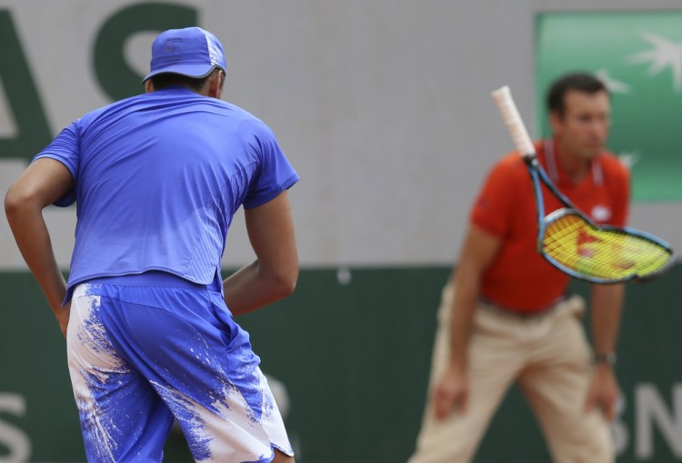 Nick Kyrgios of Australia breaks his racket as part of his meltdown Thursday in the second round of the French Open. Kyrgios, seeded 18th, lost in four sets to Kevin Anderson, a South African ranked No. 56.