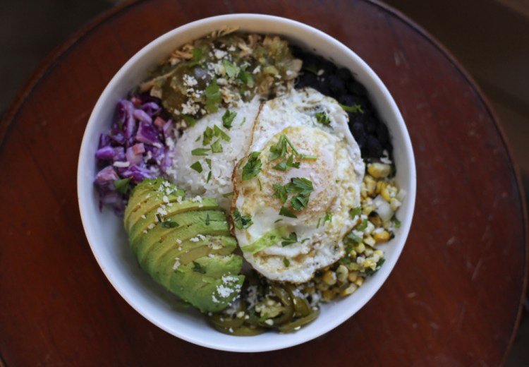 Baja bowl with avacado, salsa verde chicken and fried egg.
