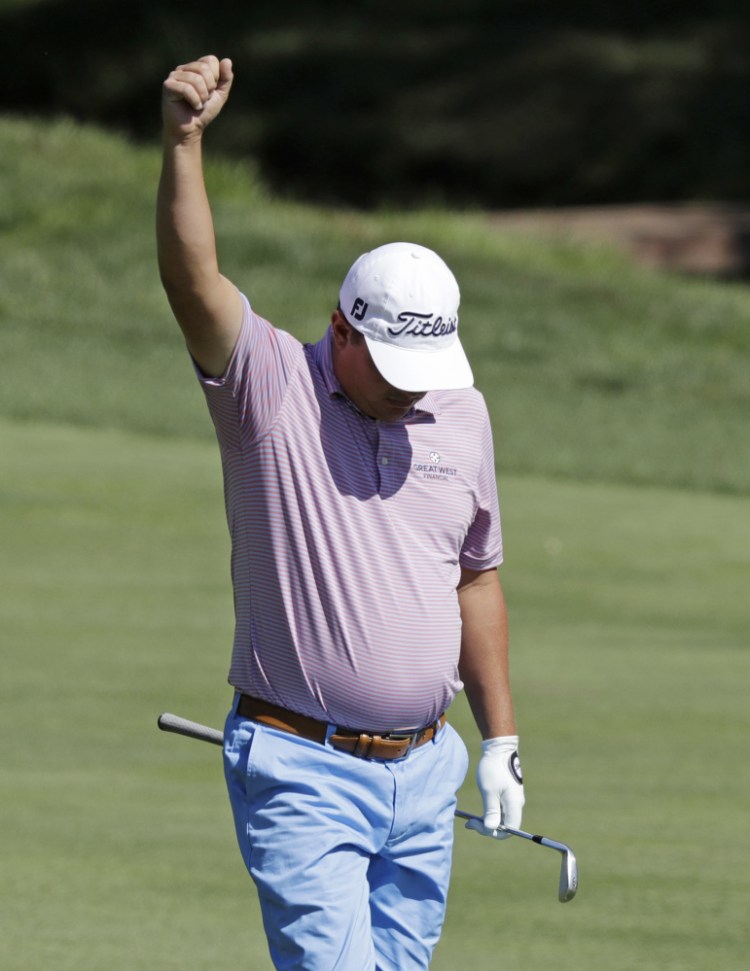 Jason Dufner celebrates after his approach shot on the 18th hole found the cup for an eagle in the second round of the Memorial in Dublin, Ohio. Dufner built a five-shot lead.