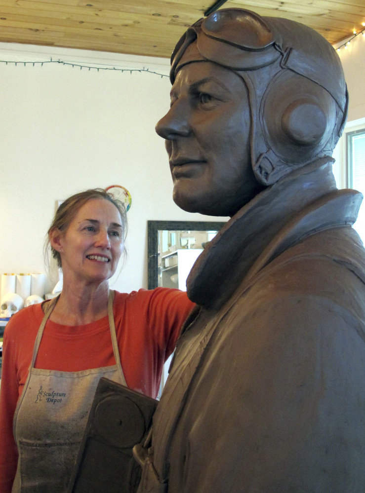 Sculptor Susan Geissler works on a clay likeness of World War II hero C. Wade McClusky Jr. in her Youngstown, N.Y., studio. The clay model will form the basis for a bronze monument planned for the Buffalo and Erie County Naval & Military Park in McClusky's hometown of Buffalo, N.Y. A dedication ceremony is scheduled for Sunday, the 75th anniversary of the Battle of Midway.