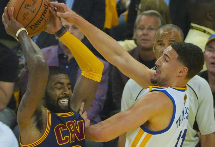 Golden State's Klay Thompson, right, held Cleveland's Kyrie Irving to 1-for-5 shooting in the Warriors' 113-91 victory in Game 1 of the NBA finals. The only field goal Irving made was an off-balance 3-pointer.