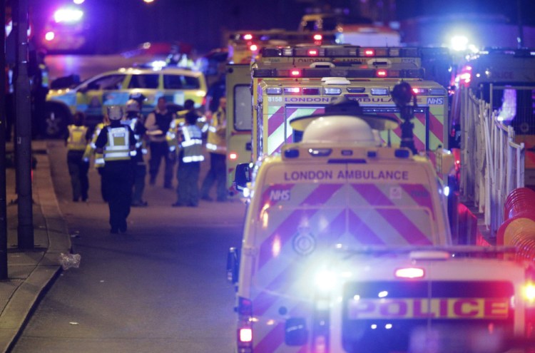 Emergency personnel respond on London Bridge on Saturday.