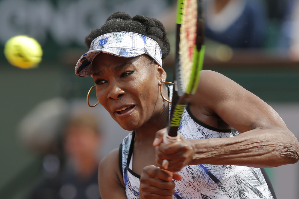 Venus Williams plays a shot during her 5-7, 6-2, 6-1 loss to 30th-seeded Timea Bacsinszky iun the fourth round at the French Open on Sunday in Paris, France.