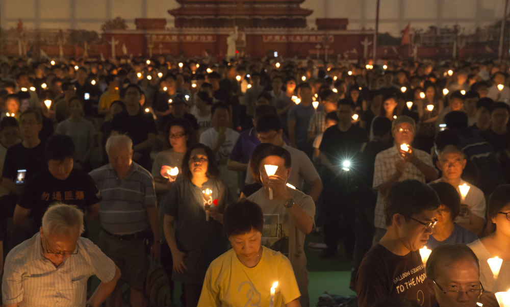 Tens of thousands of people attend an annual candlelight vigil in Hong Kong's Victoria Park on Sunday, as Hong Kong remembers victims of the Chinese government's military crackdown on protesters in Beijing's Tiananmen Square.