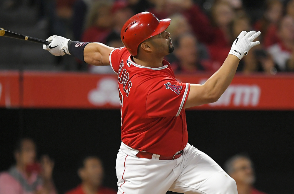 Albert Pujols of the Angels watches his 600th career home run – a grand slam Saturday night against Minnesota Twins and former teammate Ervin Santana.