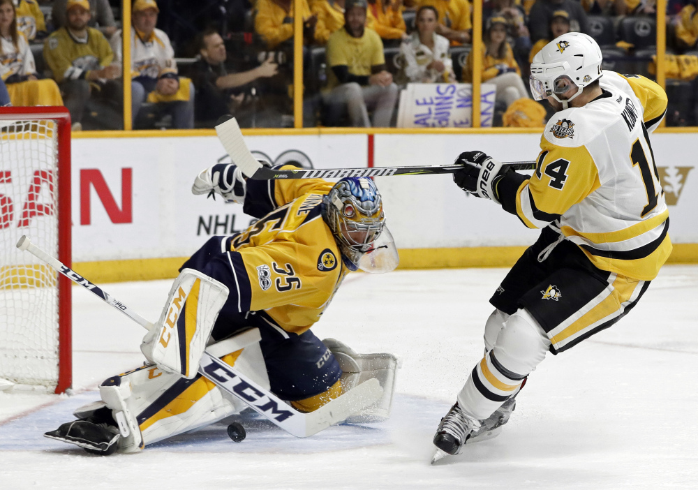 Pekka Rinne stops a shot by Penguins left wing Chris Kunitz in the second period.