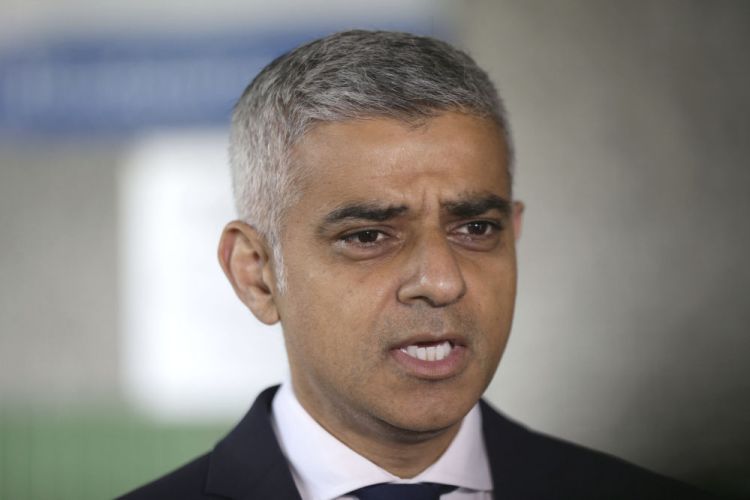 Mayor of London Sadiq Khan speaks to the media as he joined London Ambulance workers Tuesday in observing a minute's silence at the London Ambulance Service headquarters at Waterloo, central London.