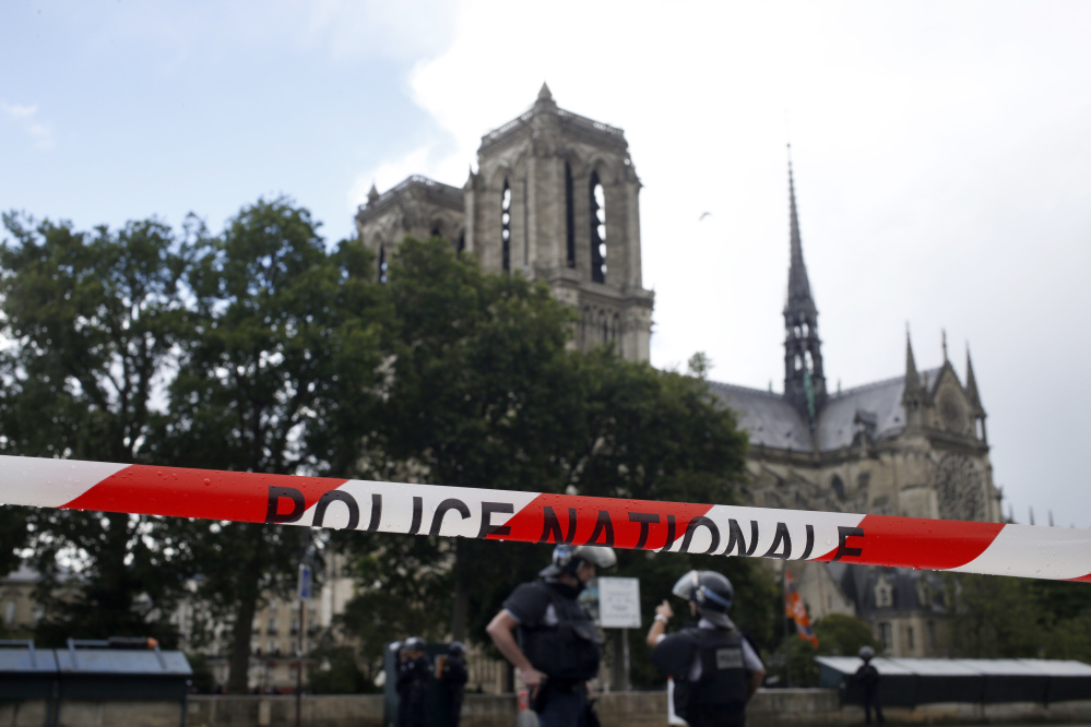 Police officers seal off the access to Notre Dame Cathedral in Paris, France, after a man attacked a police officer there on Tuesday.