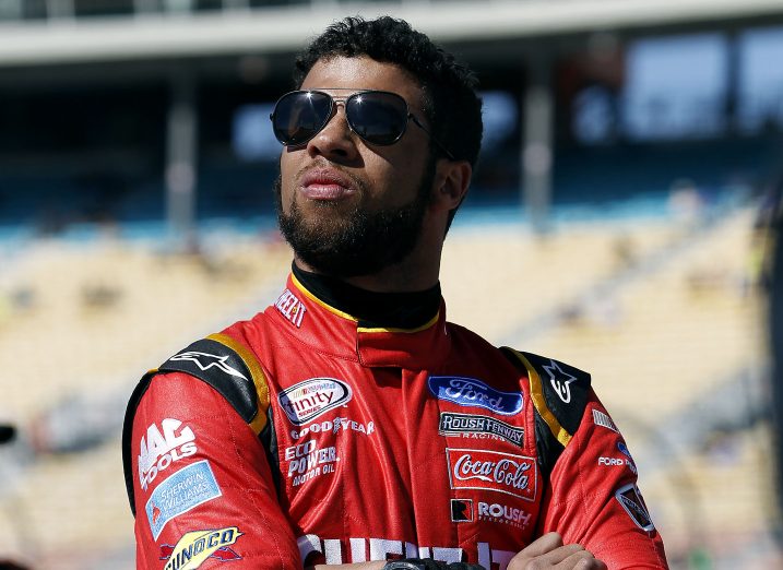 In this March 12, 2016, file photo, Darrell Wallace Jr. looks on from pit road during NASCAR Xfinity Series qualifying at Phoenix International Raceway in Avondale, Arizona.