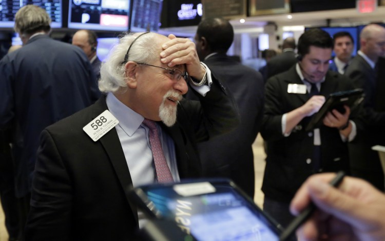Trader Peter Tuchman works on the floor of the New York Stock Exchange on Tuesday.  "This is a market that's taking a breather and is prepared to move, the question is in which direction?" said Quincy Krosby, a market strategist at Prudential Financial.