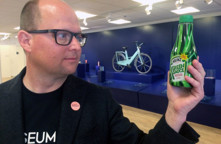 Samuel West holds a bottle of infamous Heinz green tomato ketchup at the Museum of Failure he curates in Helsingborg, Sweden. West says many brands he features want nothing to do with seeing their flops on display.