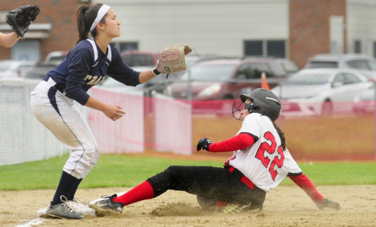 Jill Whynot of Hall-Dale reaches third base on an error Tuesday as Kiara Perez of Traip Academy waits for the throw during the sixth inning of Hall-Dale's 3-0 victory in a Class C South prelim softball game at Farmingdale.