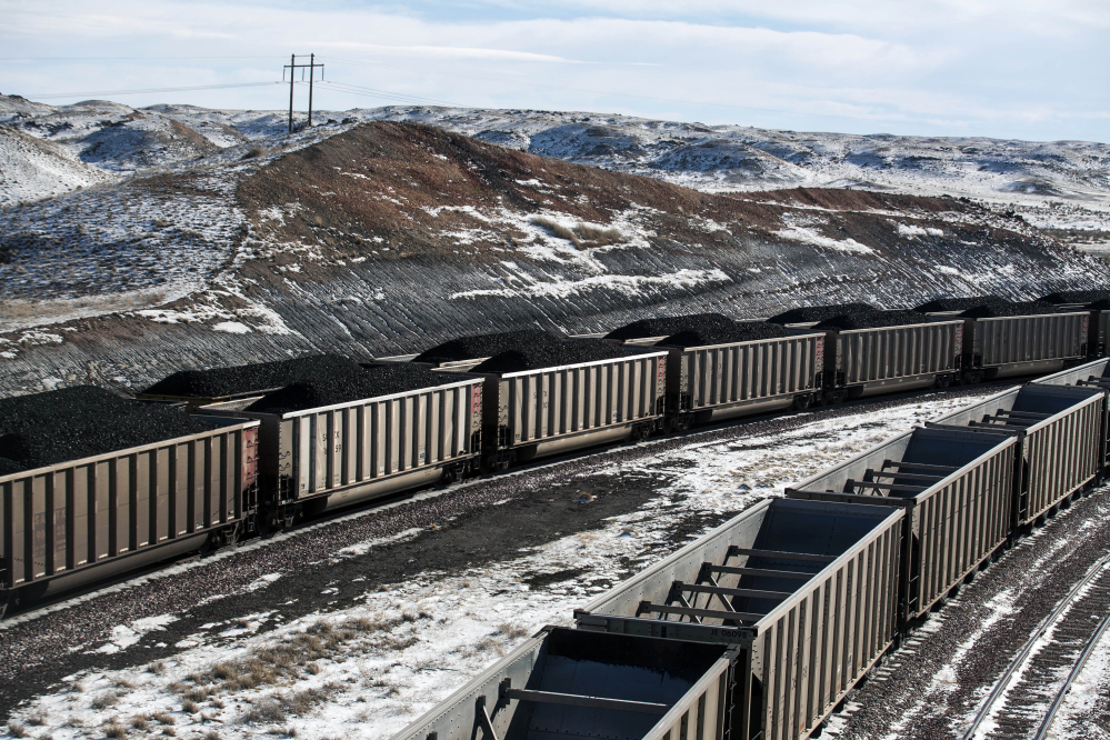 Rail cars filled with coal await transport at Cloud Peak Energy's Antelope Mine north of Douglas, Wyo., in 2014. U.S. coal production fell to 739 million tons last year, the lowest in almost four decades, amid growing competition from natural gas, wind generation and solar power. From 2011 through 2016, the coal mining industry lost an estimated 60,000 jobs.