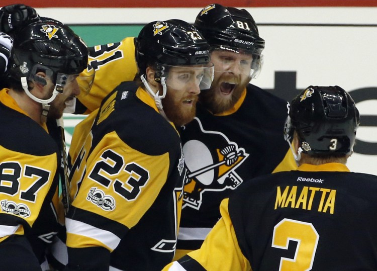 Pittsburgh's Phil Kessel, right rear, celebrates his goal against the Nashville Predators with Sidney Crosby, 87, Scott Wilson, 23, and Olli Maatta, right, during the second period of Game 5 of the Stanley Cup Final Thursday in Pittsburgh.