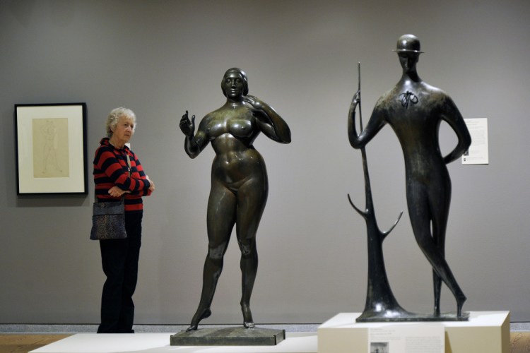 Claire Keyes of Marblehead, Massachusetts, studies "Standing Woman," by Gaston Lachaise. At right, "Man in the Open Air," by Elie Nadelman. Below, "Spirit of the Dance," by William Zorach.