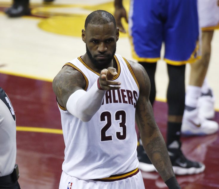 Cleveland's LeBron James points to fans during Friday night's game against Golden State in the first half of Game 4 of the NBA Finals in Cleveland