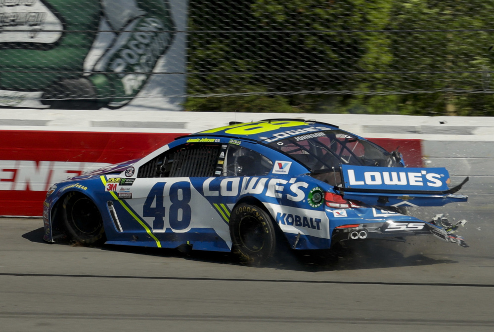 Jimmie Johnson crashes into the wall after experiencing brake problems. Johnson wasn't injured, but he finished 36th.