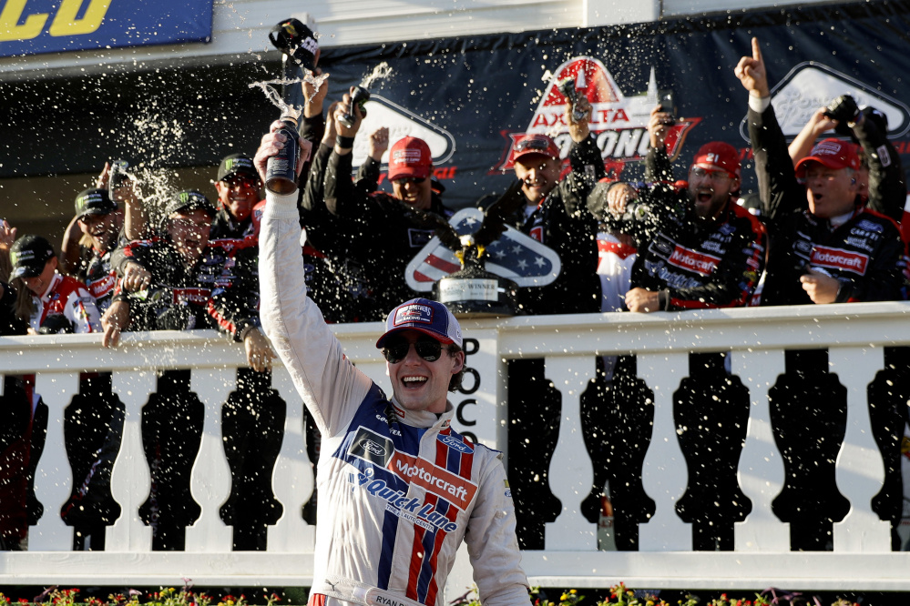 Ryan Blaney celebrates after his Cup Series victory Sunday at Pocono Raceway. Blaney took the lead from Kyle Busch late in the race and held on for his first career win in 68 races.