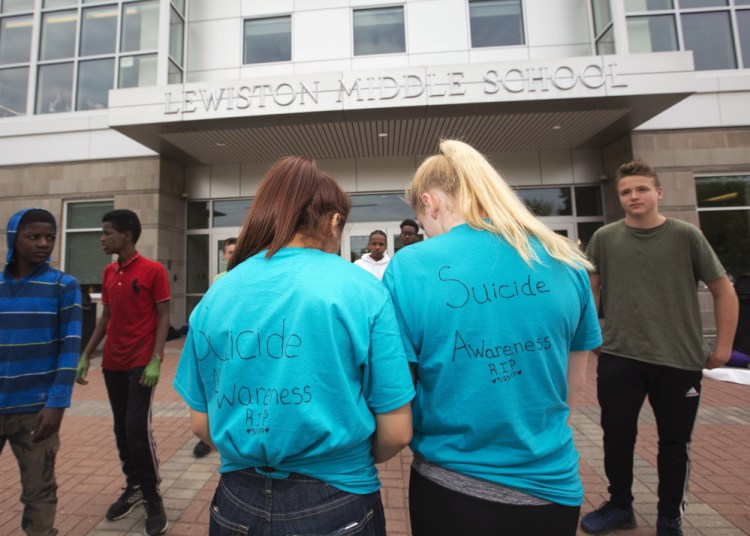 Lewiston Middle School students wear "Suicide Awareness" shirts outside the school after the suicide of seventh-grader Anie Graham. Superintendent Bill Webster says students are still visiting the extra counselors put in place at the school in the wake of Anie's death.