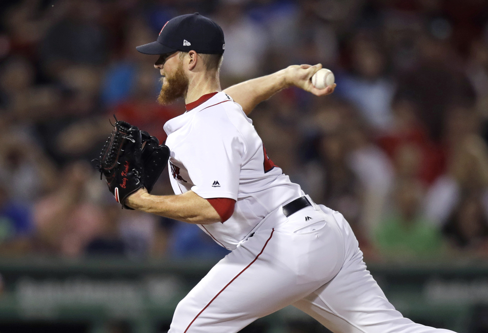 Red Sox reliever Craig Kimbrel delivers during a scoreless ninth inning against the Phillies.